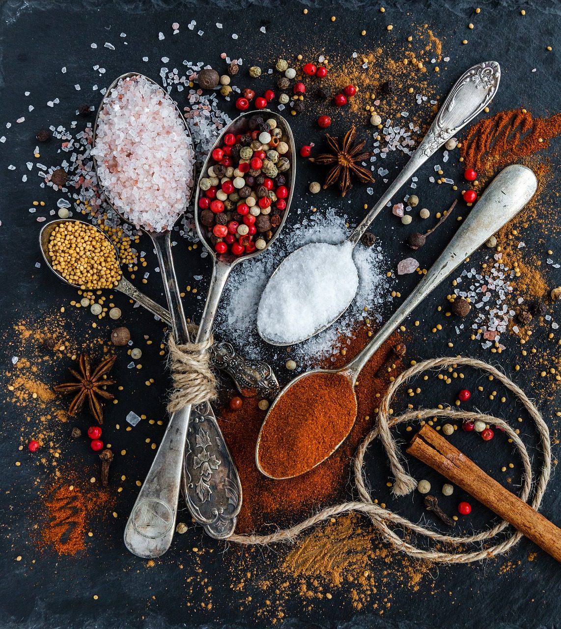 How to store spices for long shelf life - Organized spice jars in a cabinet